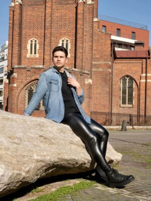 man wearing black slim fit leather leggings